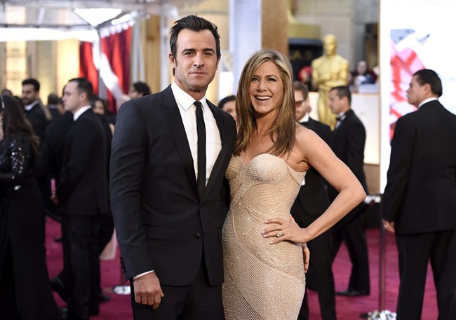 FILE - In this Feb. 22, 2015 file photo, Justin Theroux, left, and Jennifer Aniston arrive at the Oscars in Los Angeles. Howard Stern has revealed details about the secret wedding between Jennifer Aniston and Justin Theroux, including that Jimmy Kimmel officiated. 