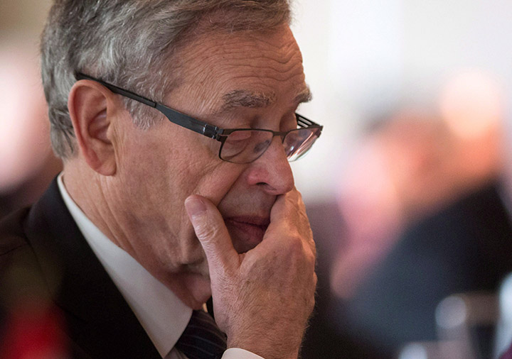 Finance Minister Joe Oliver looks over his notes before addressing the Australia-Canada Economic Leadership Forum in Vancouver in July.