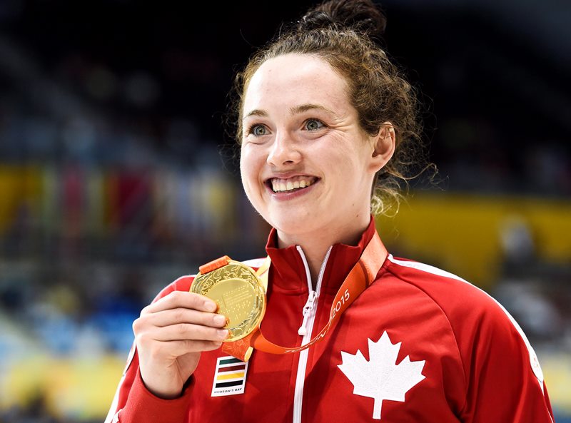 Morgan Bird of Canada shows off her gold medal after winning the women's S8 400m and the women's S8 50m during the Parapan Am Games in Toronto on Sunday, August 9, 2015. 