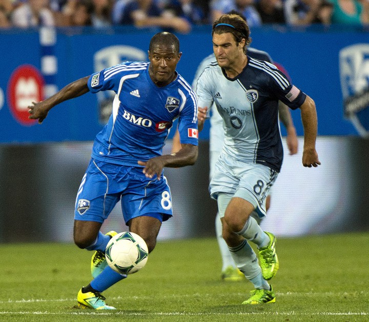 Montreal Impact's Patrice Bernier, left, breaks away from Sporting Kansas City's Graham Zusi during second half MLS soccer action in Montreal, Saturday, July 27, 2013.
