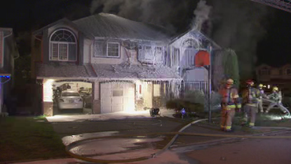 Port Coquitlam family escapes house fire - image