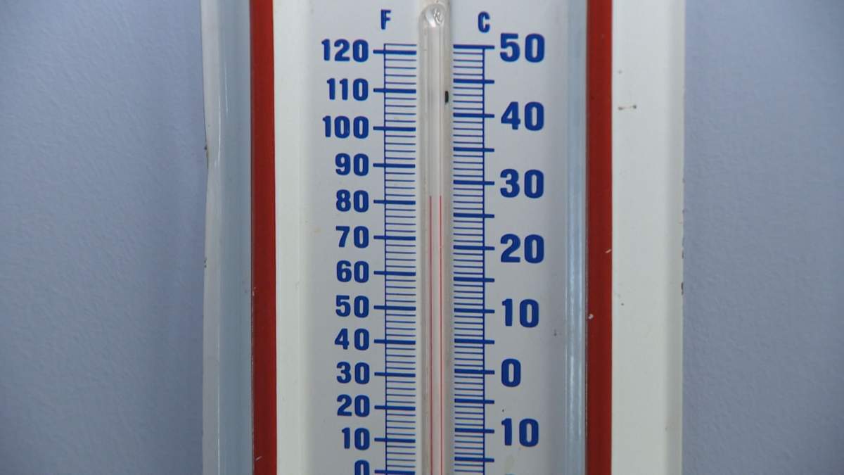 The thermometer in Greg Boothman’s room show’s a temperature of just under 30 degrees