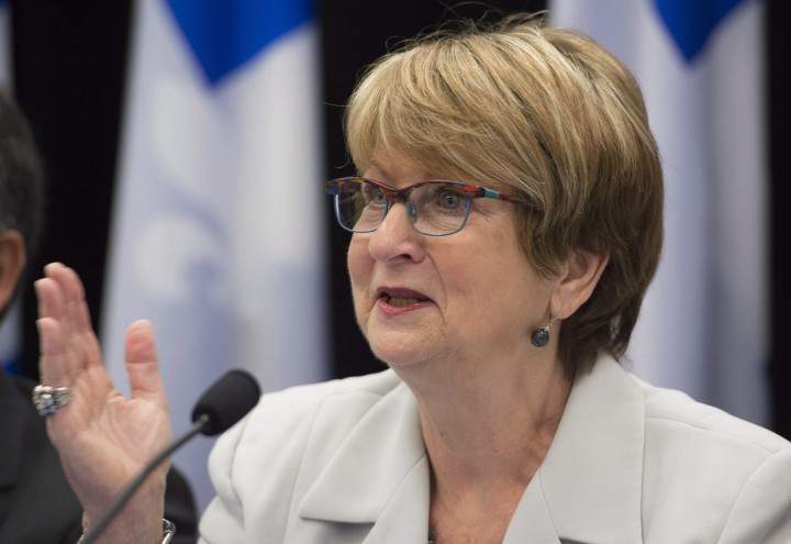 Lucienne Robillard, president of the committee on revision of governmental programs in the province, unveils a report Monday, August 31, 2015 in Quebec City.