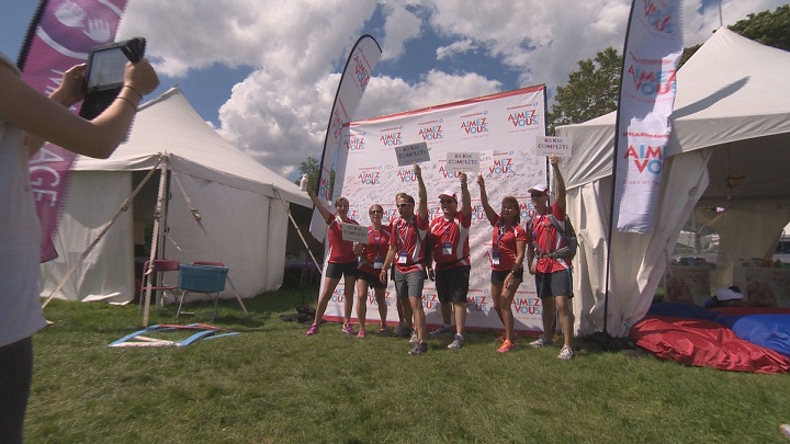Participants in Montreal’s Weekend to End Women’s Cancers celebrate at the finish line. Sunday, Aug. 23, 2015.