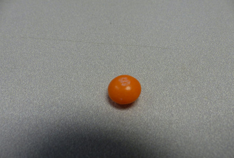 A picture of the solitary orange Skittle featuring a faded white
"S" is in a series of more than 125 photos of recovered stolen
property posted online Tuesday by York .