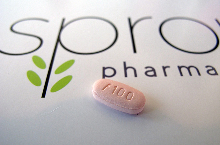 In this June 22, 2015, photo, a tablet of flibanserin sits on a brochure for Sprout Pharmaceuticals in the company's Raleigh, N.C., headquarters. 