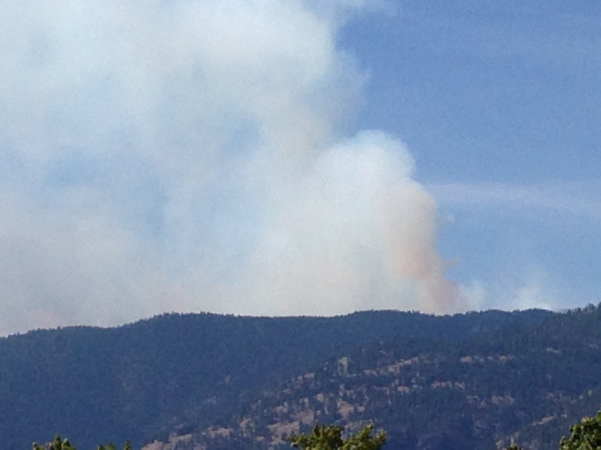 Smoke rising from the Testalinden Creek Wildfire as a result of controlled burns.