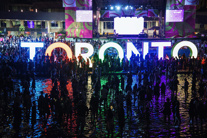 Pan Am Games Toronto sign, with performances in backgroundToronto's night sky was ablaze on July 26, 2015 as the closing ceremony marked the end of the Pan Am Games 2015.