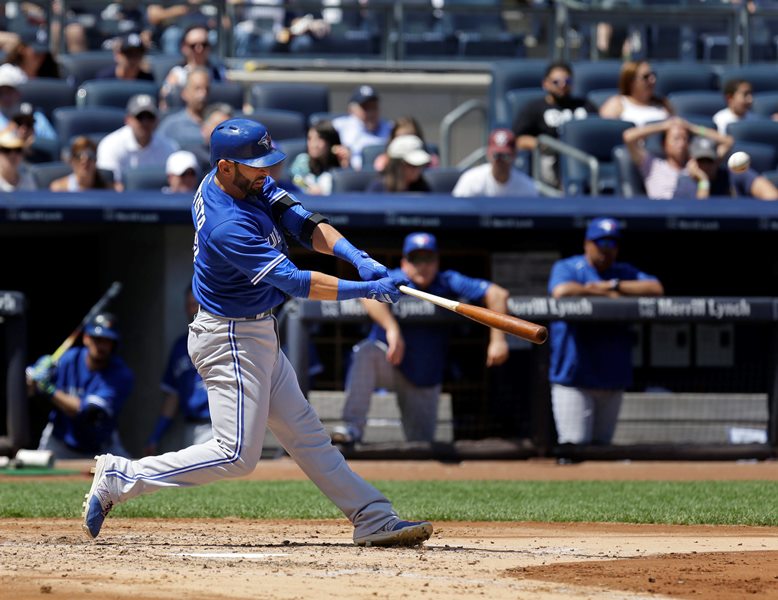 Toronto Blue Jays' Jose Bautista hits a solo home run during the fourth inning of the baseball game against the New York Yankees at Yankee Stadium, Sunday, Aug. 9, 2015, in New York.