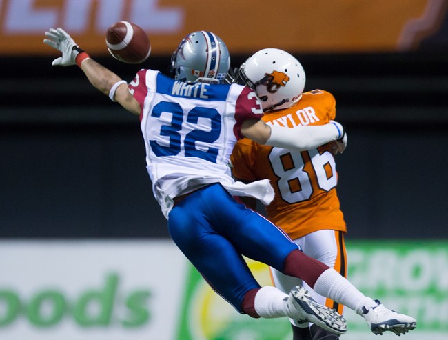 Montreal Alouettes' Mitchell White (32) breaks up a pass intended for B.C. Lions' Courtney Taylor (86) during the second half of a CFL football game in Vancouver, B.C., on Thursday August 20, 2015. Upon review the Alouettes were assessed a pass interference penalty on the play.