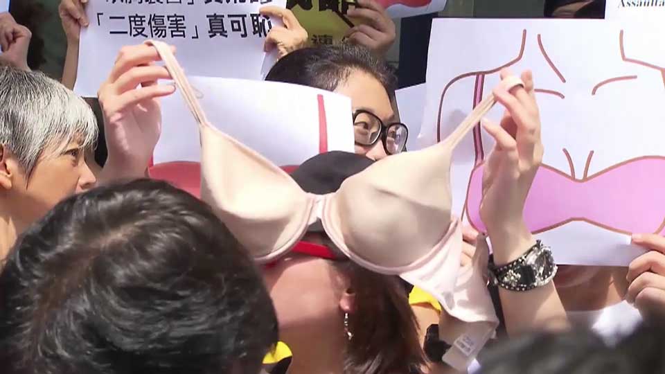 Bra protest in Hong Kong after woman jailed for 'breast assault' of police  officer - National
