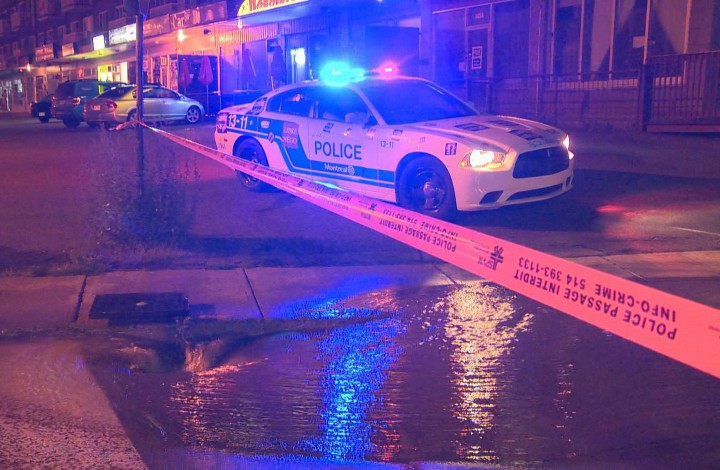 Police on the scene of a water main break in Lasalle, Monday, August 17, 2015.