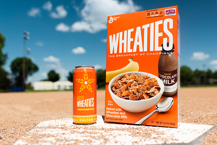 This undated photo provided by General Mills shows a box of Wheaties cereal next to a can of limited-edition HefeWheaties beer. Wheaties said it is partnering with a craft brewery to make the beer.