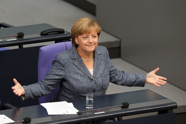 German Chancellor Angela Merkel gestures as she attends a debate at the German parliament prior to a vote on another bailout package for Greece, in the German Bundestag in Berlin, Wednesday, Aug. 19, 2015. 
