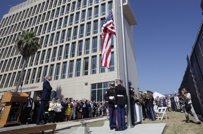 U.S. Secretary of State John Kerry watches the raising of the American flag at the newly opened U.S. Embassy in Havana, Cuba, Friday, Aug. 14, 2015. 