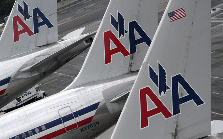 American Airlines airplanes are parked at their gates at JFK International airport in New York. 