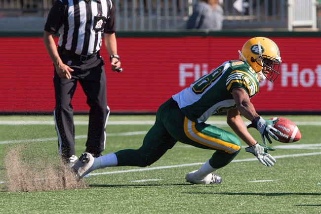 Edmonton Eskimos' Skye Dawson (88) fumbles during second half CFL football action against the Toronto Argonauts in Fort McMurray, Alta., on Saturday, June 27, 2015. The Calgary Stampeders acquired receiver Dawson from the Edmonton Eskimos on Monday for a conditional exchange of 2017 draft picks.