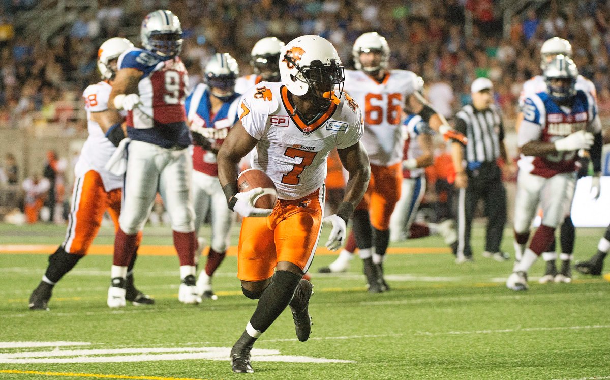BC Lions' Lavelle Hawkins, centre, runs in for a touchdown during first half CFL football action against the Montreal Alouettes in Montreal on Thursday, September 3, 2015. 