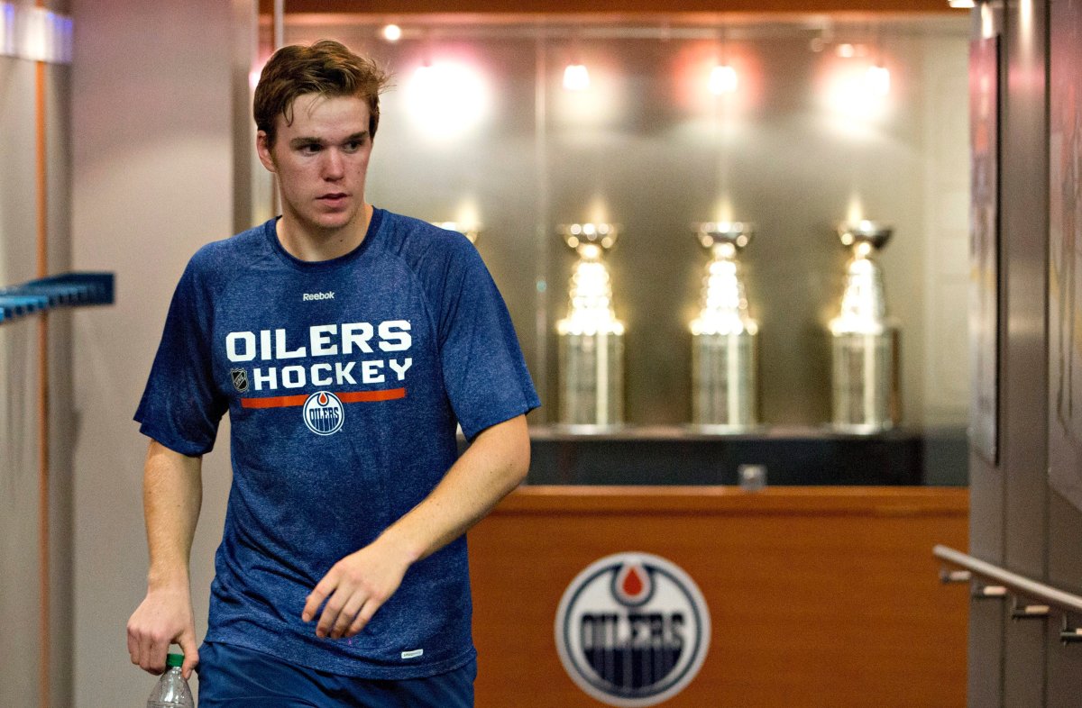 Connor McDavid makes his way to a press conference after fitness testing during the Edmonton Oilers rookie camp in Edmonton, Alta., on Thursday, September 10, 2015. 