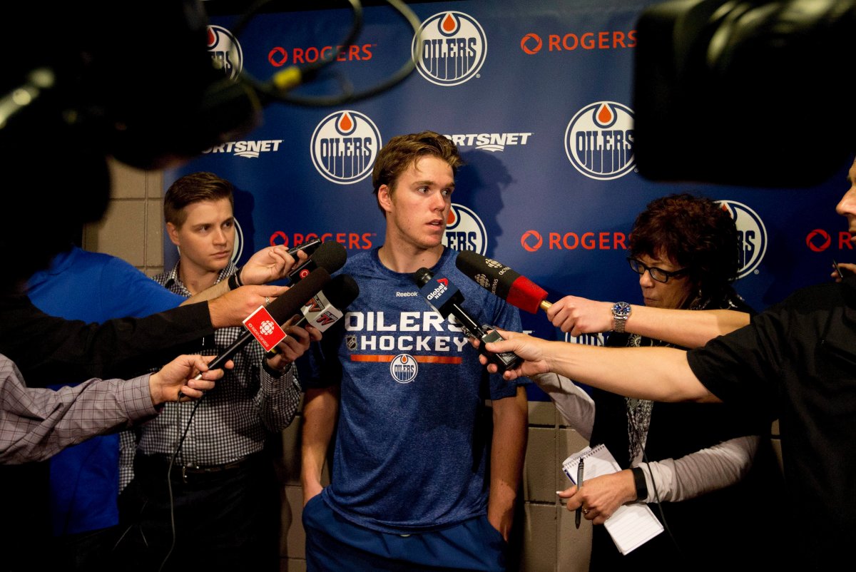 Connor McDavid speaks to media during a scrum at the Edmonton Oilers rookie camp in Edmonton, Alta., on Thursday, September 10, 2015. 