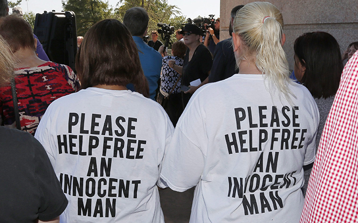 Ericka Glossip-Hodge, left, daughter of Richard Glossip, and Billie Jo Ogden Boyiddle, right, Richard Glossip's sister, listen during a rally to stop the execution of Richard Glossip, in Oklahoma City, Tuesday, Sept. 15, 2015.