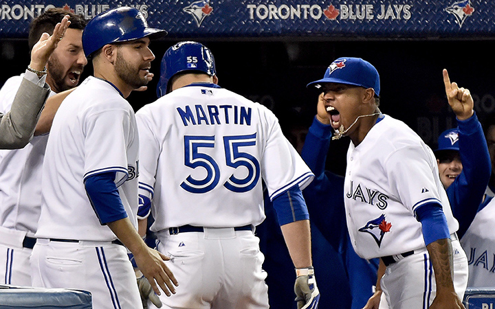 Toronto Blue Jays catcher Russell Martin celebrates with Blue Jays pitcher Marcus Stroman after hitting a three run home run against the New York Yankees during seventh inning AL baseball action in Toronto on Wednesday, September 23, 2015.