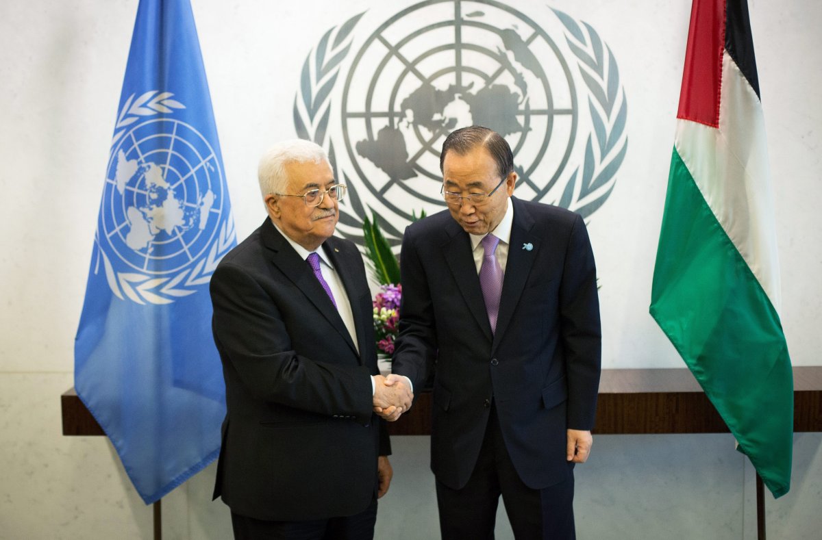 Palestinian President Mahmoud Abbas, left, poses with United Nations Secretary-General Ban Ki-moon at the United Nations headquarters Wednesday, Sept. 30, 2015.