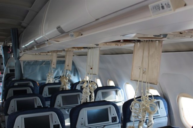 Damage to the passenger cabin of an Air Canada plane that crashed at Halifax’s airport is seen in a handout photo from the Transportation Safety Board.