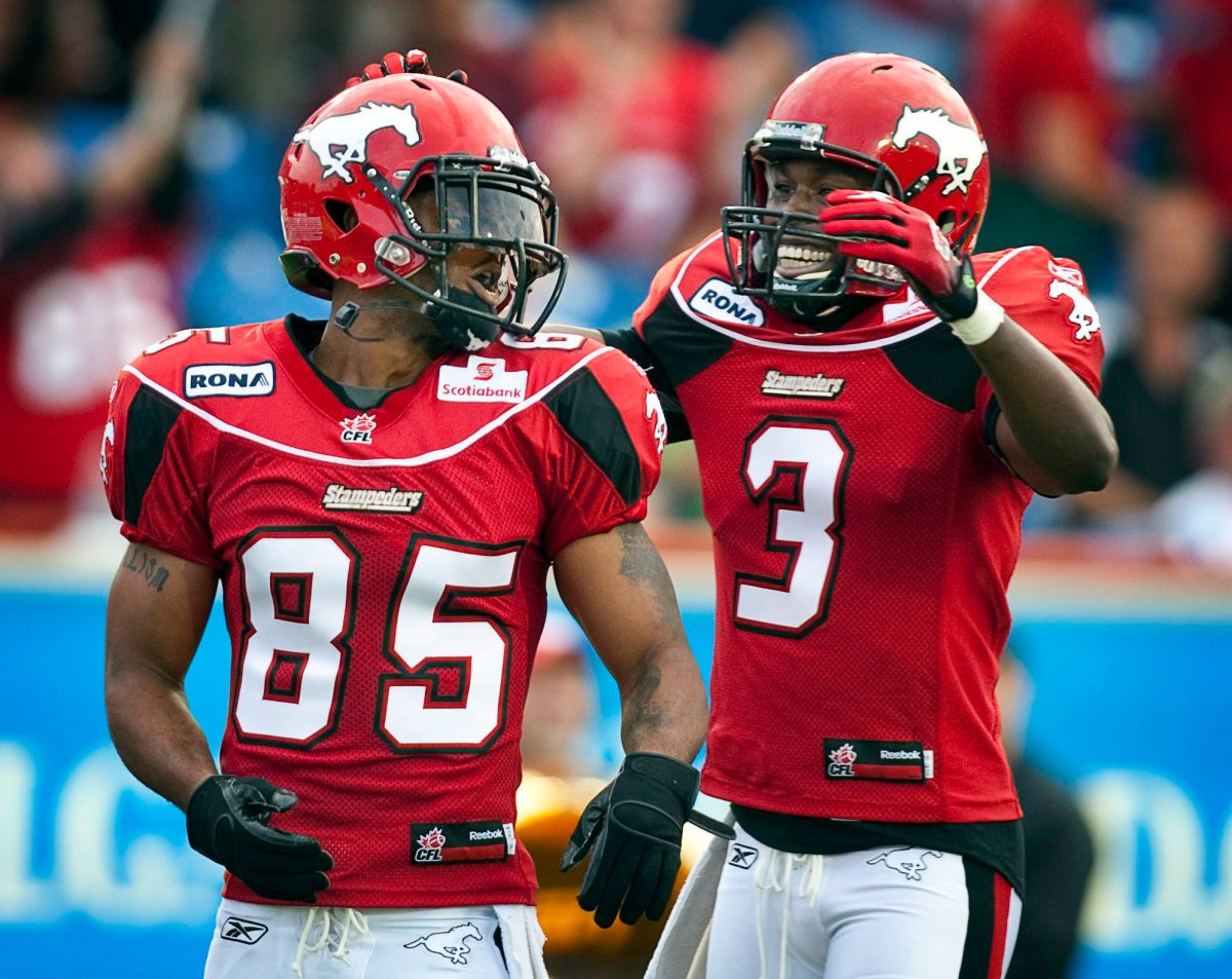 Calgary Stampeders Ken-Yon Rambo, left, celebrates his touchdown with Ryan Thelwell during first quarter CFL football action against the Winnipeg Blue Bombers in Calgary, Saturday, July 31, 2010. 