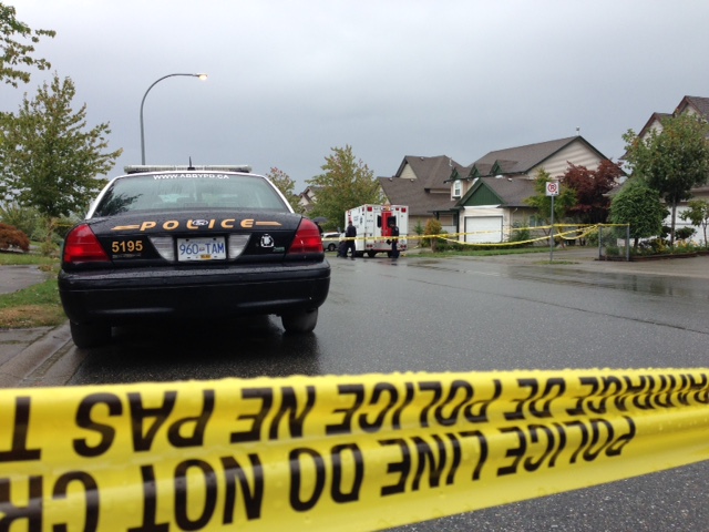 Police investigate the scene of a shooting that killed a 74-year-old man in Abbotsford on September 2, 2015.