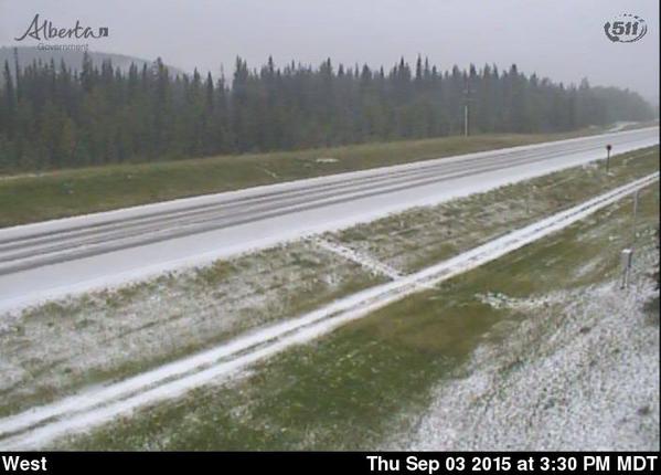 Snow covers the David Thompson highway near Nordegg, AB. Image from the Alberta 511 highway camera.