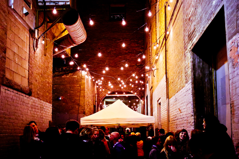 The design fest alley wrap party in the Exchange District drew dozens downtown last year. 