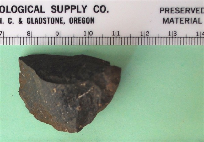 What remains of a First Nations stone tool artifact from the ancient village site on Galiano Island, B.C. A new study determined volcanic rock was taken right off the beach after being deposited there 12,000 years ago by glacier. The finding dispels a theory that villagers had to leave the site to access better toolstone. 