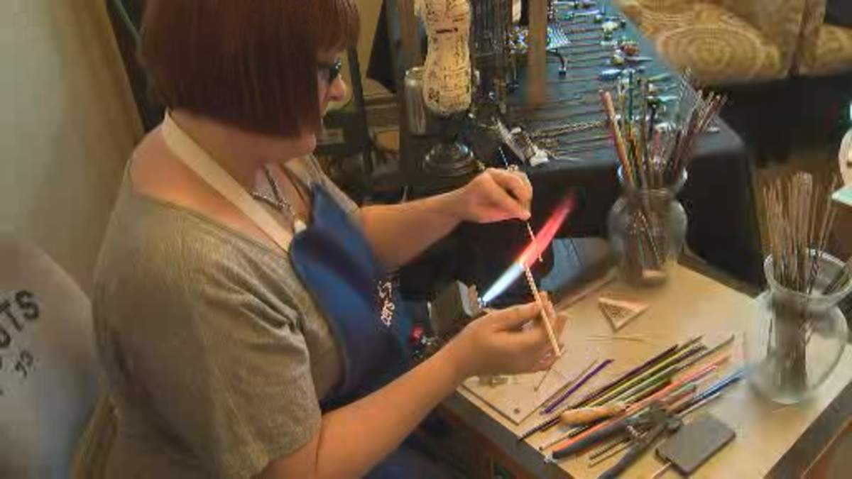 Shauna Hayward blowing glass beads