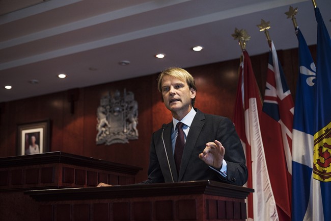 Minister of Citizenship and Immigration Chris Alexander speaks to the media about Canada's plan to provide faster help for Syrian and Iraqi Refugees wishing to come to Canada during a press conference in Toronto on Saturday, September 19, 2015.