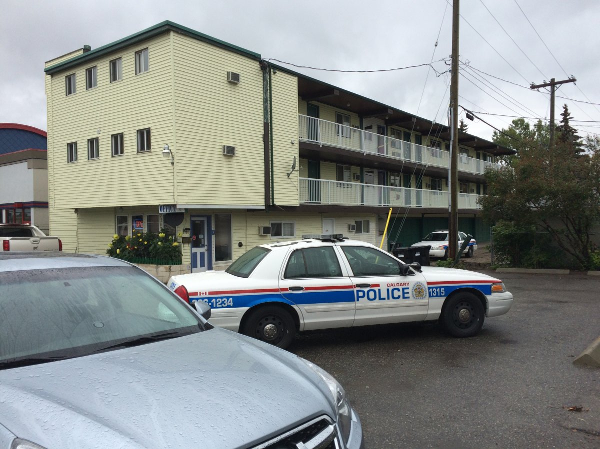 Calgary police investigate after a body was found in a motel in the 2100 block of 16 Avenue N.W. on Monday, Sept. 14, 2015.