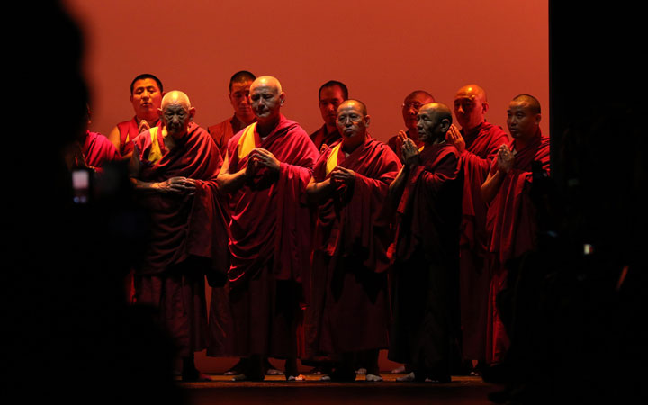 A group of Buddhist monks chant at the start of the Prabal Gurung presentation at New York Fashion Week in New York on September 13, 2015.