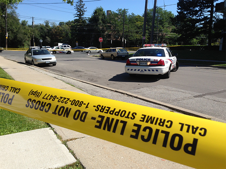 Police have taped off the area where a cab was fired on in Toronto. 