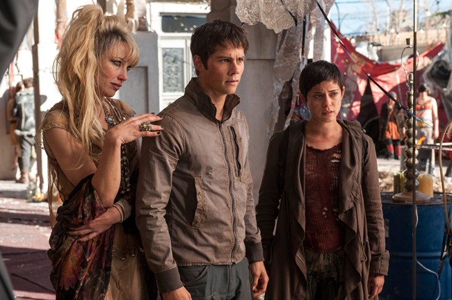 In this image released by 20th Century Fox, Jenny Gabrielle, from left, Dylan O’Brien and Rosa Salazar appear in a scene from the film, "Maze Runner: The Scorch Trials.".