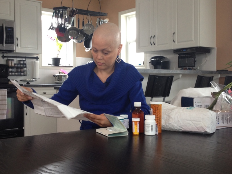 Trina Arnold reads about her next round of chemotherapy.