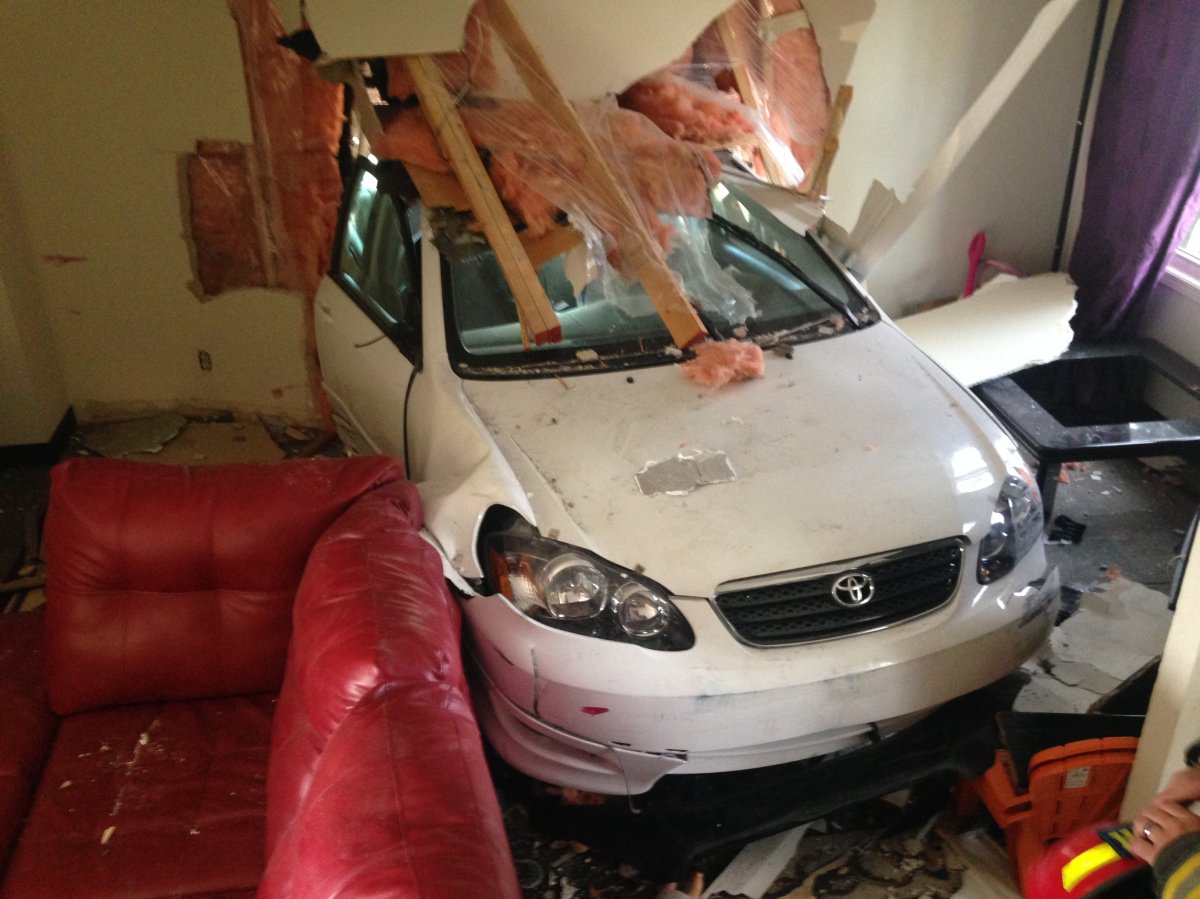 A woman was nearly run down inside her southeast Calgary living room when a car struck her home on September 23, 2015.