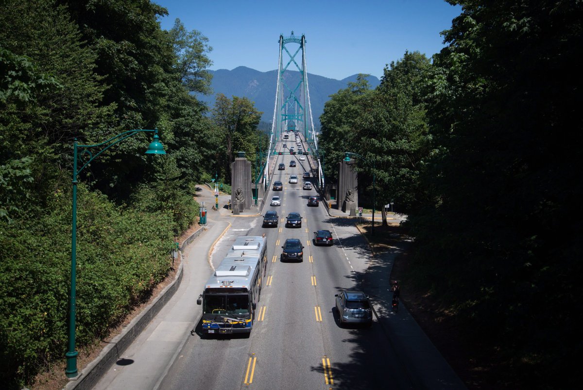 A transit bus enters the Stanley Park causeway after crossing over the Lions Gate Bridge from North Vancouver into Vancouver, B.C.