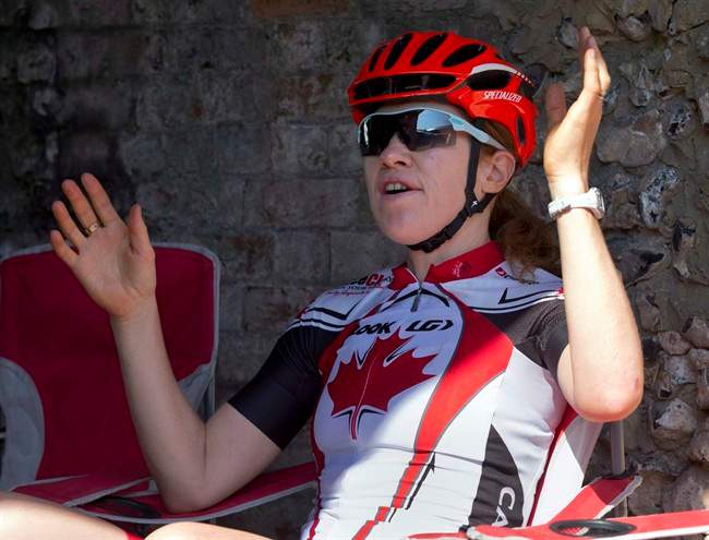 Canadian Olympic cyclist Clara Hughes talks with coaches prior to a training ride in Horsley, Sussex, England on Wednesday July 25, 2012. Former Olympian Hughes has revealed a previously undisclosed anti-doping rule violation from 1994.