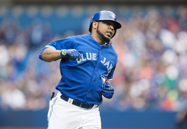 Toronto Blue Jays' Edwin Encarnacion rounds the bases following a three-run home run during first inning MLB baseball action against the Detroit Tigers in Toronto on Saturday, August 29, 2015.
