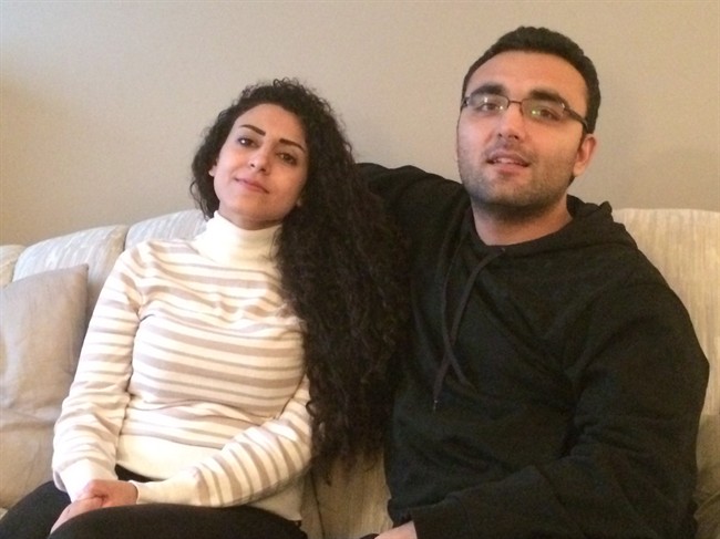 Syrian refugees Mohmmed Darweesh, right, and Reem Younes discuss the threats they faced in their homeland and their journey to their new home in Winnipeg, Man., on Thursday, September 10, 2015. The couple were sponsored by a church and a non-profit group and have settled into a new life in the Manitoba capital.
