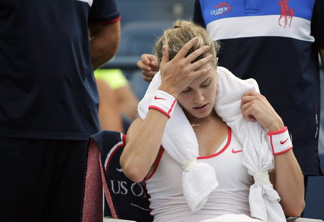 Eugenie Bouchard takes a break between games against Dominika Cibulkova during the third round of the U.S. Open tennis tournament, Friday, Sept. 4, 2015, in New York. 