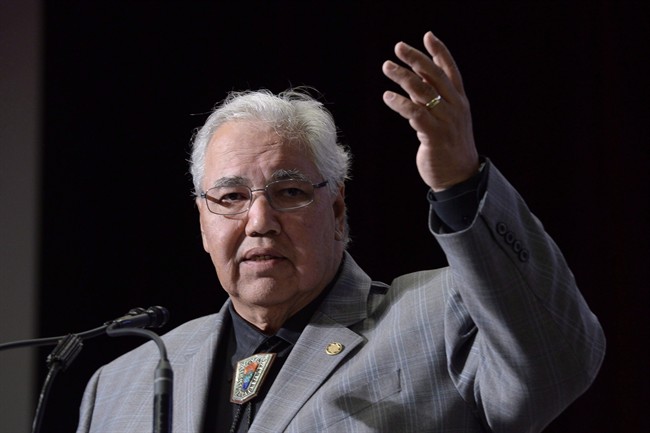 Commission chairman Justice Murray Sinclair raises his arm asking residential school survivors to stand at the Truth and Reconciliation Commission in Ottawa on June 2, 2015. Murray has been announced as the recipient of 2015's Duff Roblin Award from the University of Winnipeg. 
