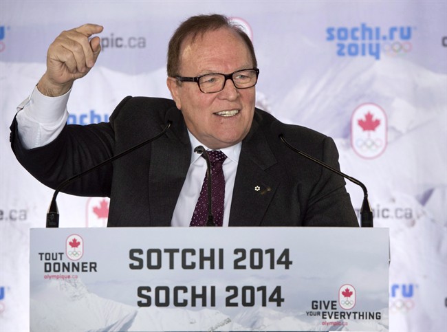 FILE -- Marcel Aubut addresses athletes during the announcement of the Canadian bobsled team for the 2014 Olympic Winter Games in Sochi, Monday, December 16, 2013 in Montreal. Aubut has stepped down as president of the Canadian Olympic Committee and chairman of the Canadian Olympic Foundation as he is investigated for sexual harassment. 