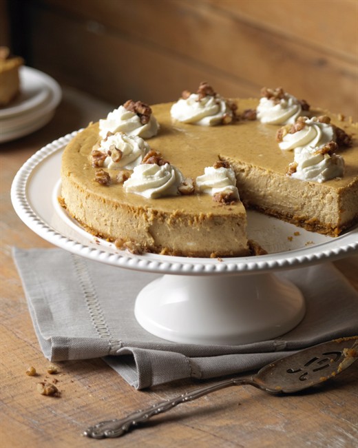 This elegant pumpkin cheesecake, decorated with whipped cream and sweetened walnuts, is a delicious way to end a holiday feast or dinner party. 
