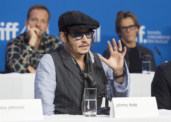 Actor Johnny Depp gestures during a press conference promoting the film "Black Mass" during the 2015 Toronto International Film Festival in Toronto on Monday, September 14, 2015.